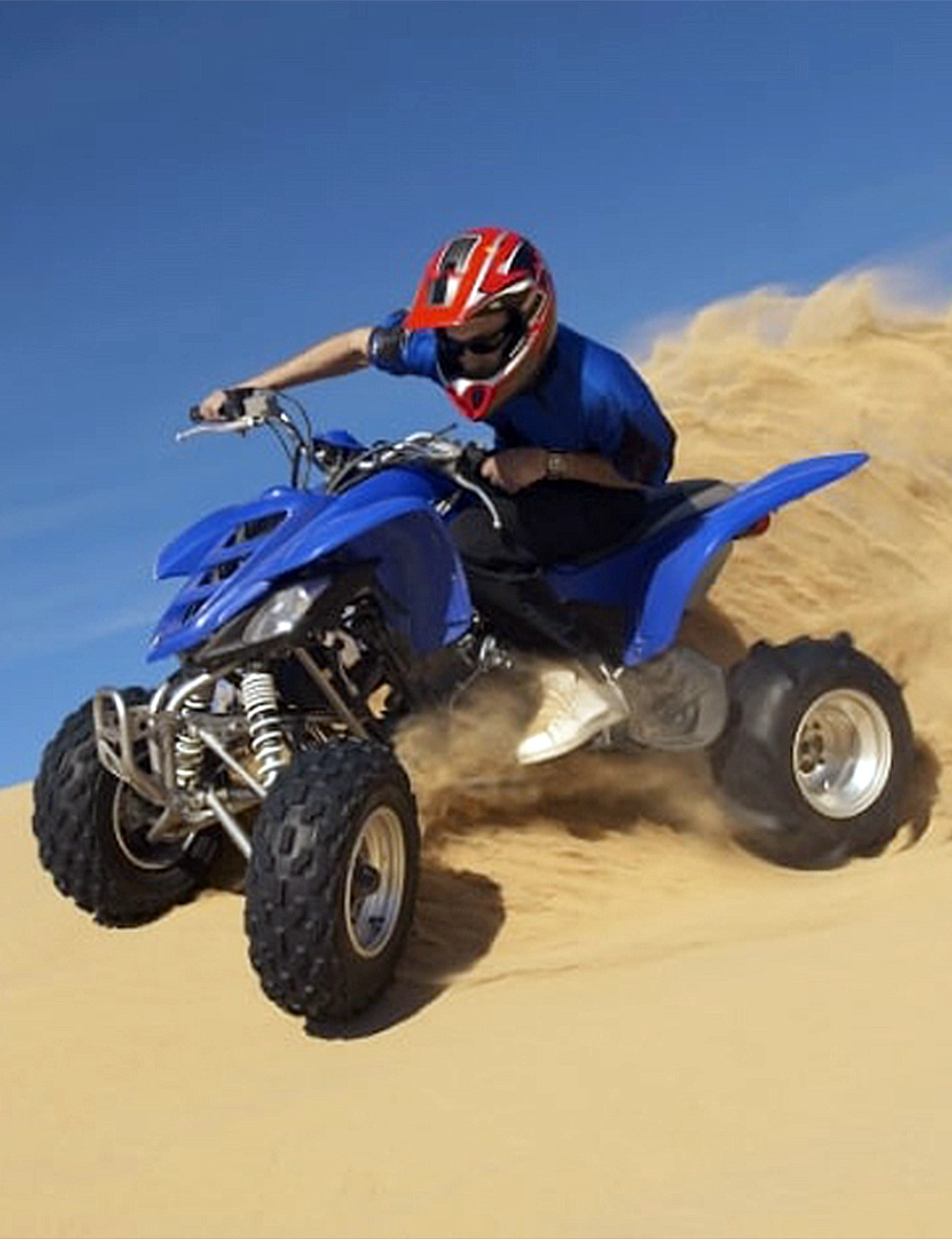 Quad biking across the golden dunes